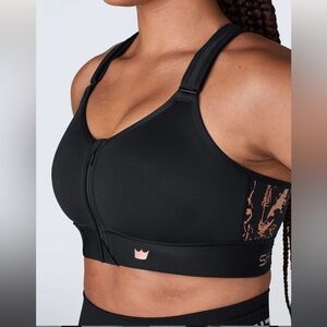 SHEFIT Black Sports Bra with Rose Gold Accents
